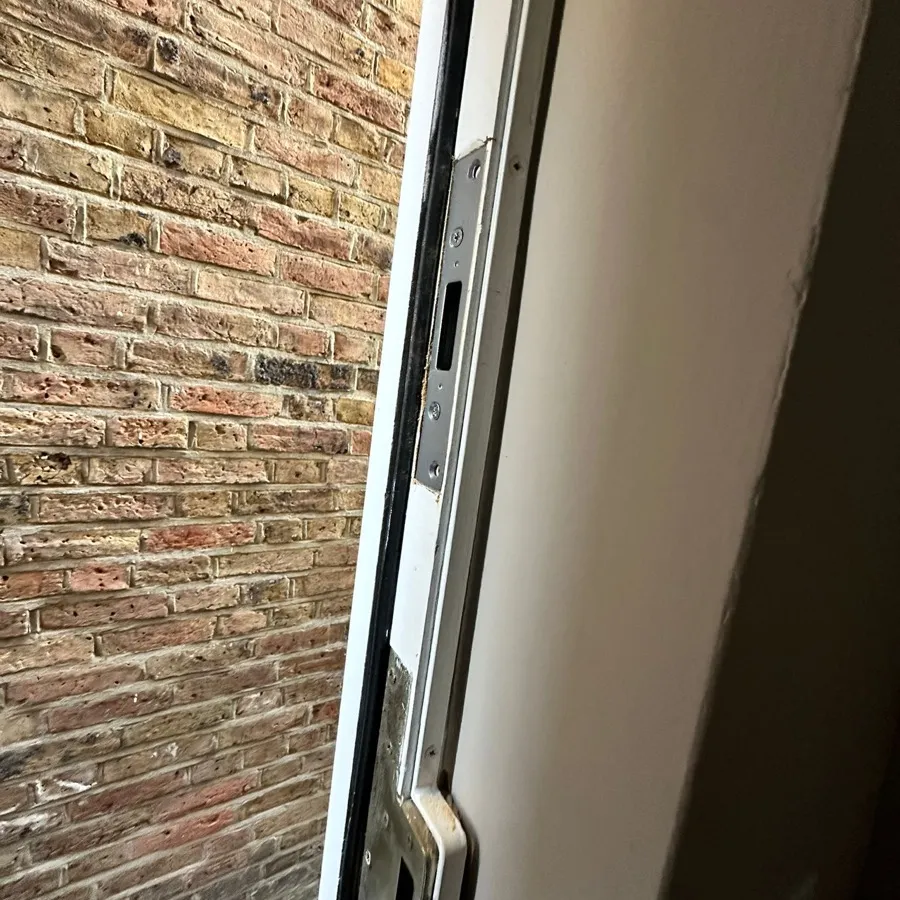 New strike plates fitted into a repaired timber frame after a break-in