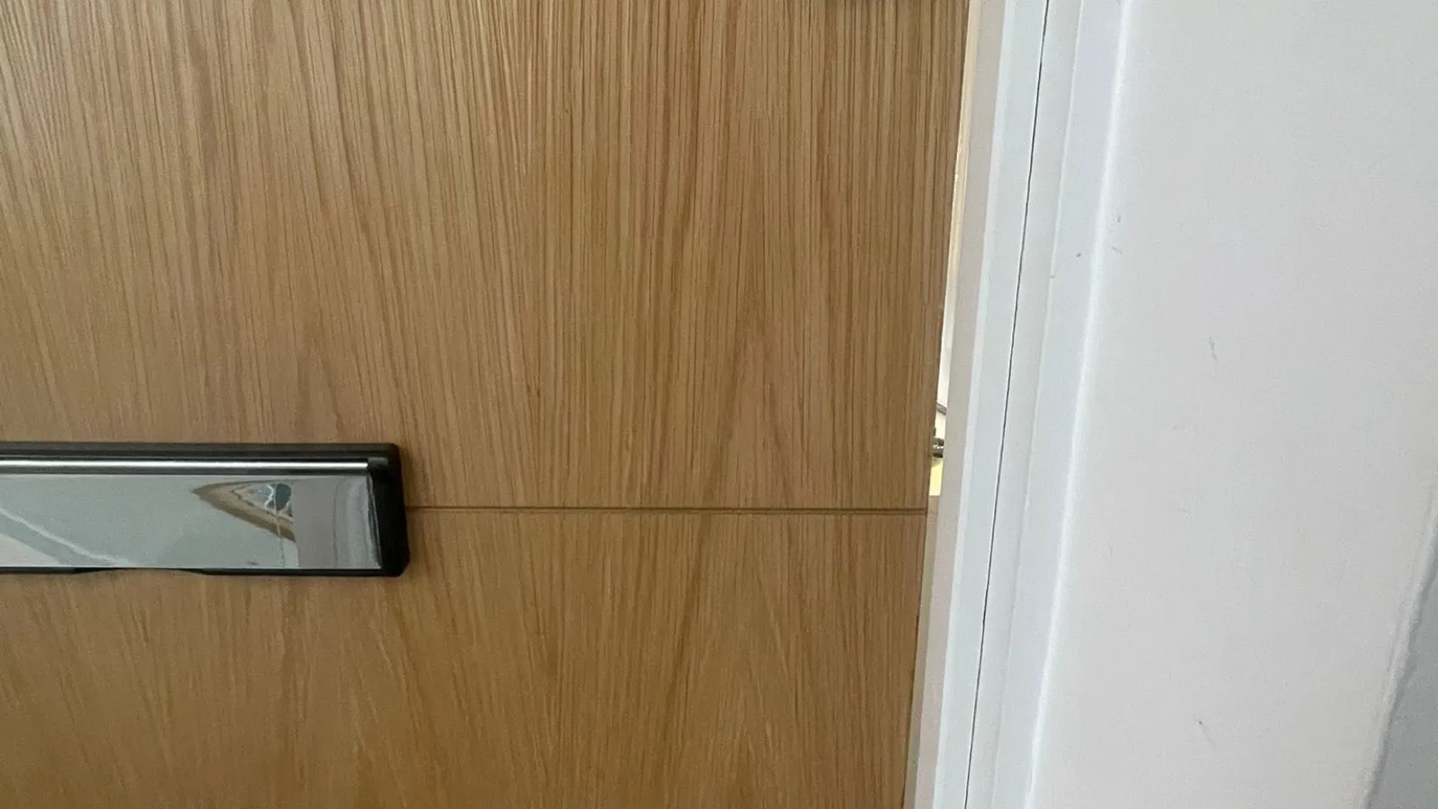A flat entrance door with a newly fitted nightlatch and separate deadlock