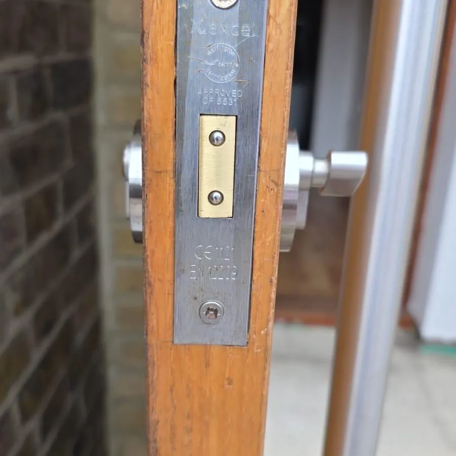 A BS EN 12209 mortice deadlock fitted in a timber door between tenancies